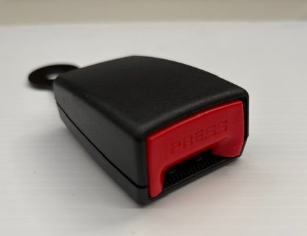 Black and red device with 'PRESS' on a white background